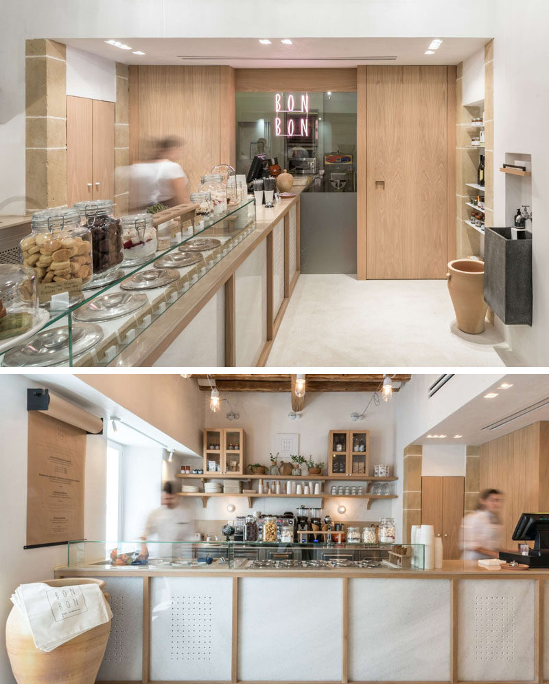 The interior of this modern cafe has been set up with a service counter that leads from the front door to the back wall. #Cafe #CafeDesign #InteriorDesign #RetailDesign