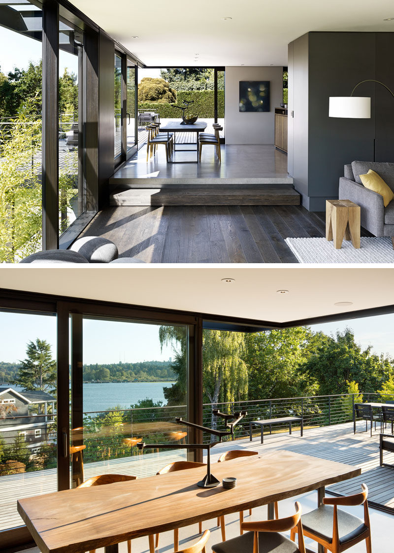 Around the corner from this modern living room is the dining room that opens up to an outdoor entertaining deck with lake views. #ModernDiningRoom #Windows