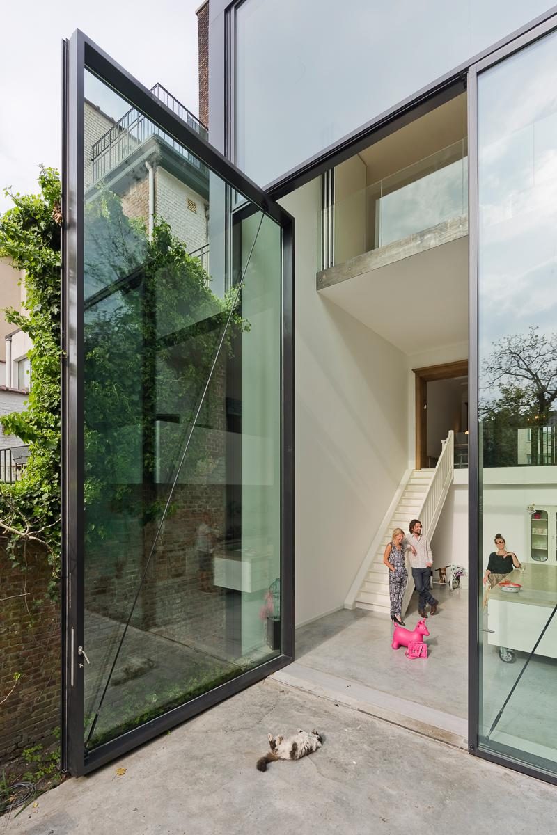 11 Pivoting Glass Doors That Make A Statement And Let