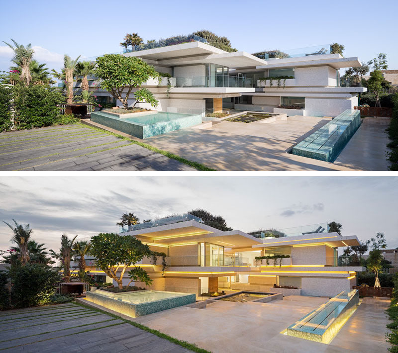 The entrance to this modern villa is via a courtyard surrounded by landscaping and water features. Lighting accents the various horizontal lines that make up the architecture of the house. #Courtyard #Architecture #ModernLandscaping #ModernHouse #Lighting