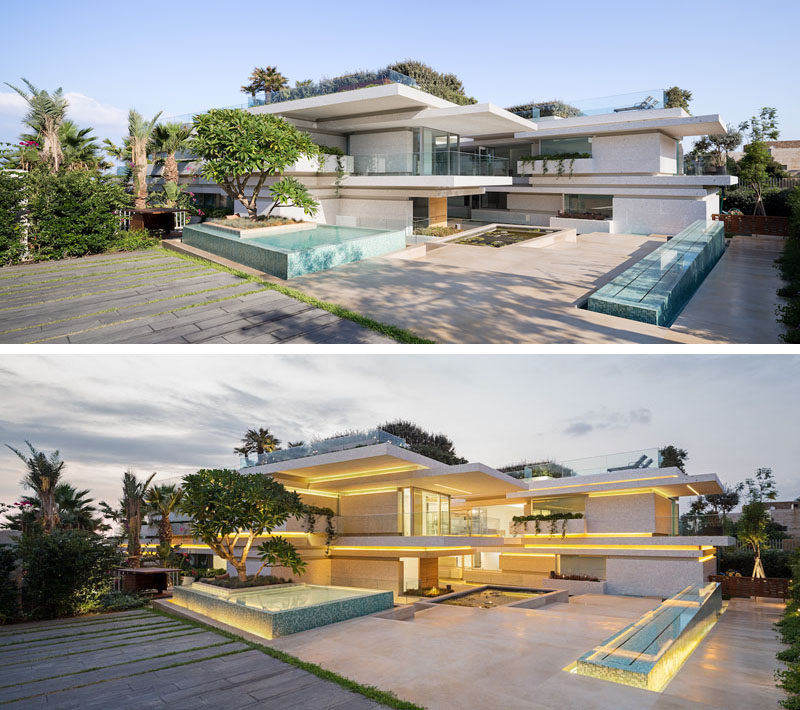 The entrance to this modern villa is via a courtyard surrounded by landscaping and water features. Lighting accents the various horizontal lines that make up the architecture of the house. #Courtyard #Architecture #ModernLandscaping #ModernHouse #Lighting