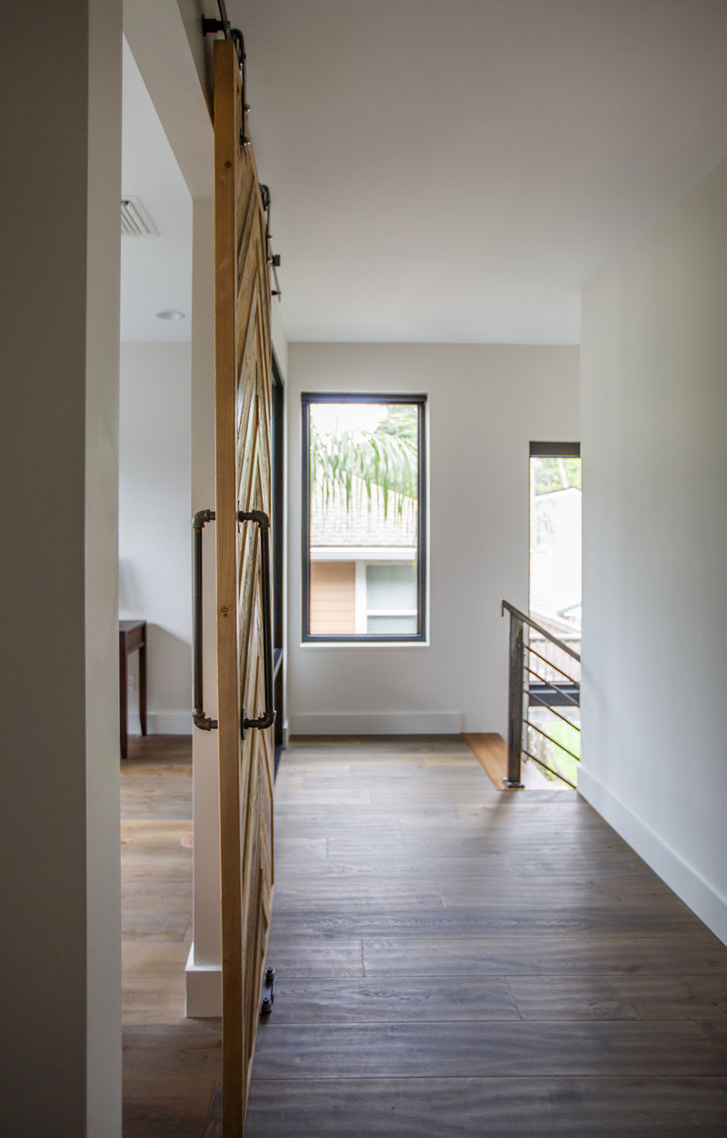 At the top of these stairs is a hallways with wood flooring. #Flooring #InteriorDesign #Hallway