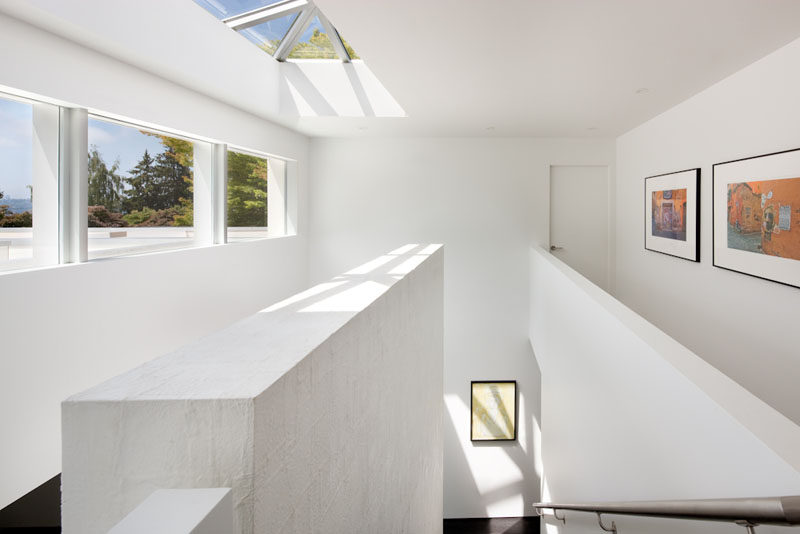 Skylights, windows and white walls make this interior feel bright and airy. #Skylight #Windows #InteriorDesign