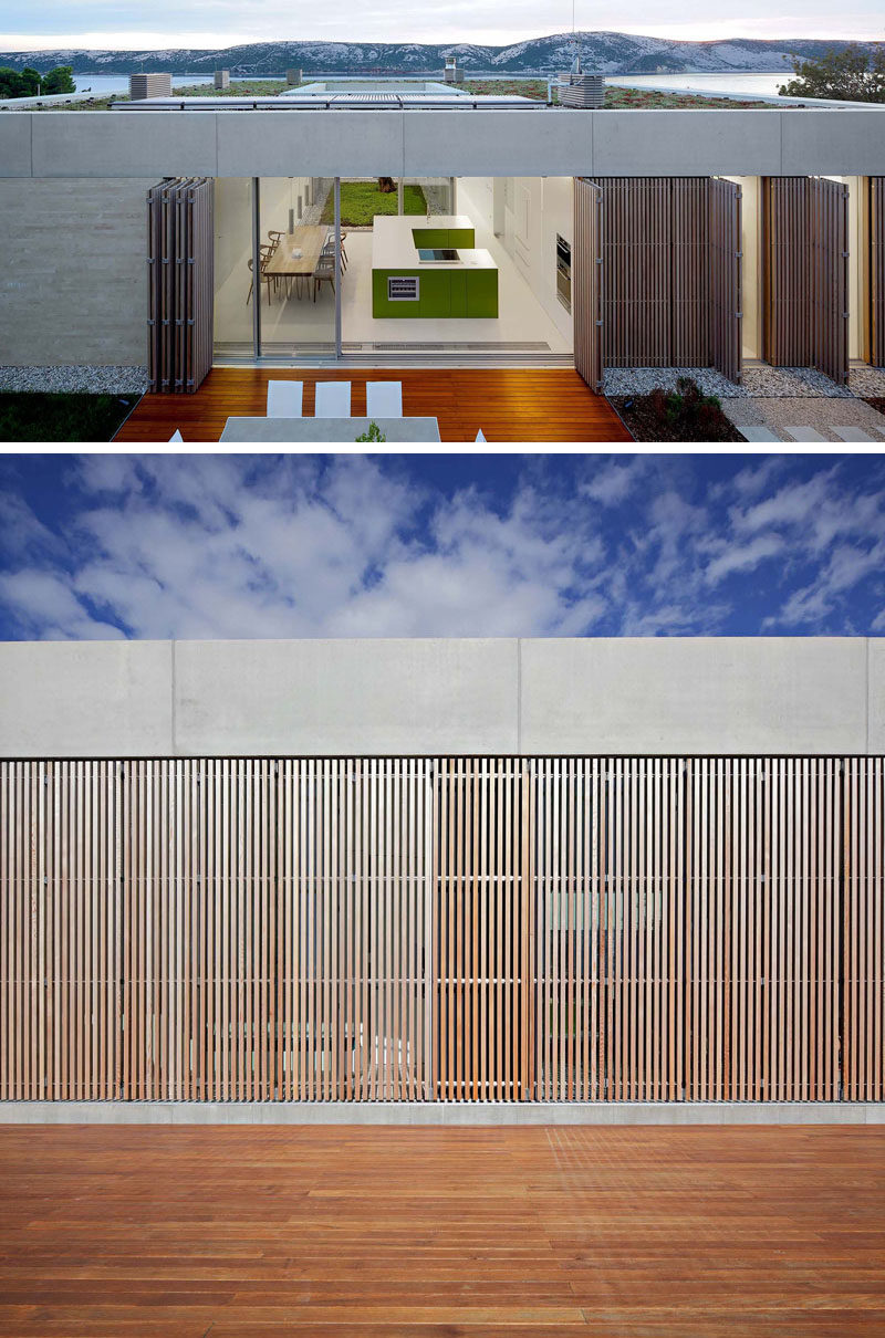 At night, vertical cedar wood brise-soleils can be closed to provide some privacy and security to this modern house. #Architecture #Screens #Shutters #ModernHouse