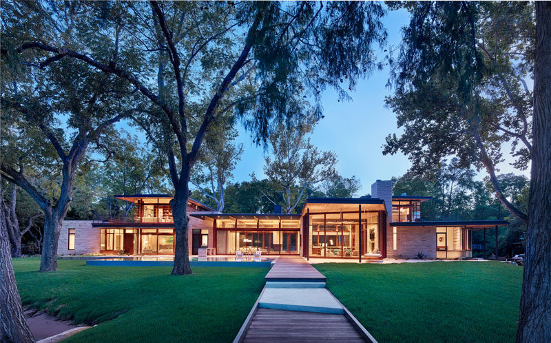 A Parallel Architecture have designed this modern wood, limestone and glass house that sits lakeside in Austin, Texas. #ModernArchitecture #ModernHouse