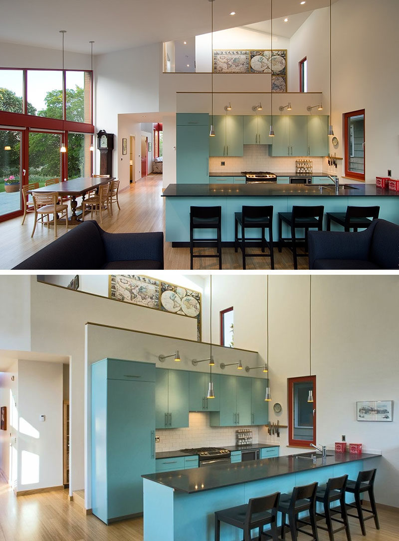 Soft blue kitchen cabinets in this modern kitchen add a pop of color to the open floorplan. #InteriorDesign #BlueKitchen #BlueCabinets #KitchenDesign