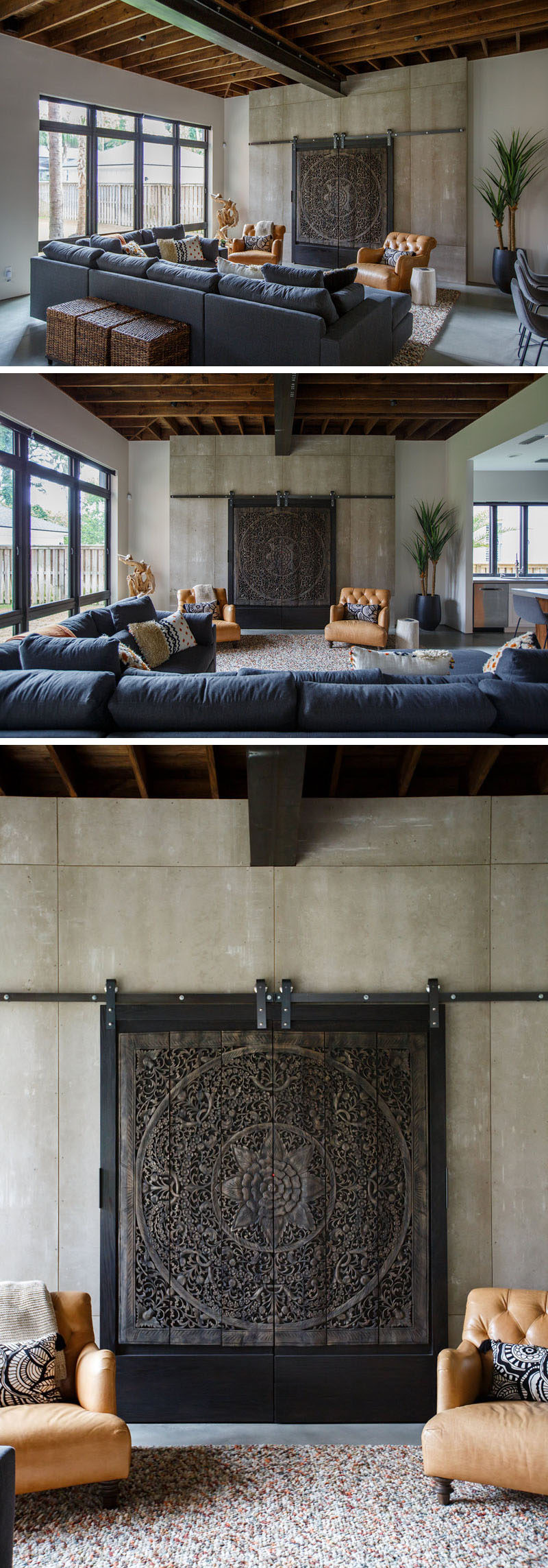 In this modern living room, artistic carved wood panels on a simple metal track hide the television from view when it's not in use. #LivingRoom #InteriorDesign #ArtisticPanels #HideTV