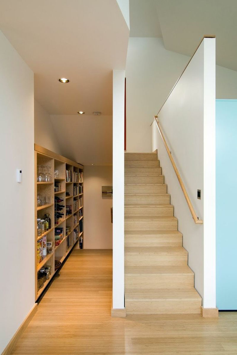 Located in a small alcove next to the stairs and kitchen is a small pantry and storage area. #Pantry #Storage #InteriorDesign