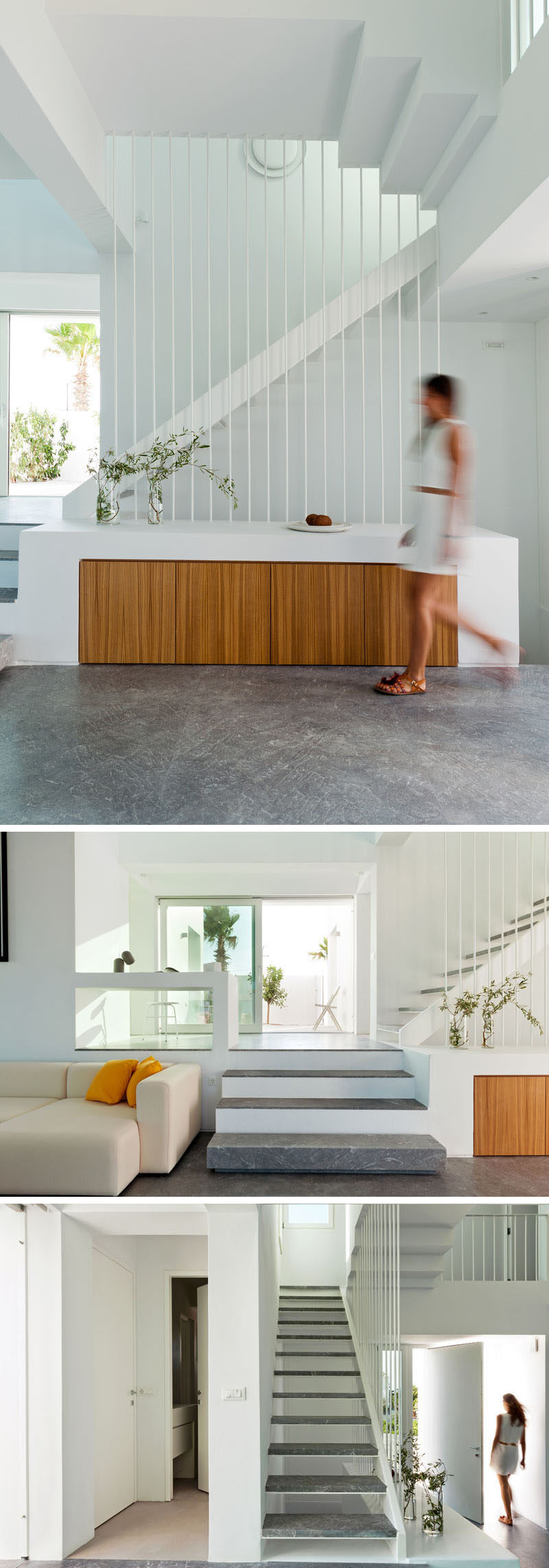 In this modern house interior, a few small steps lead to a landing with a desk as well as access to a bedroom and a bathroom. Gortynis grey marble has been used for flooring in this area and on the stair treads. #ModernStairs #GreyStairTreads #InteriorDesign #ModernInterior