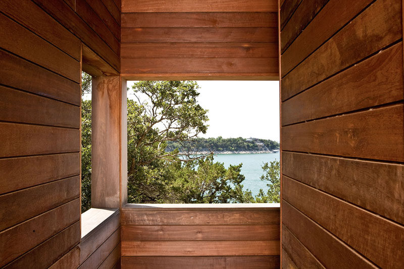 In this towering vacation home, rectangular openings invite breezes to circulate and offer views of trees, sky, and lake. #Architecture #Wood