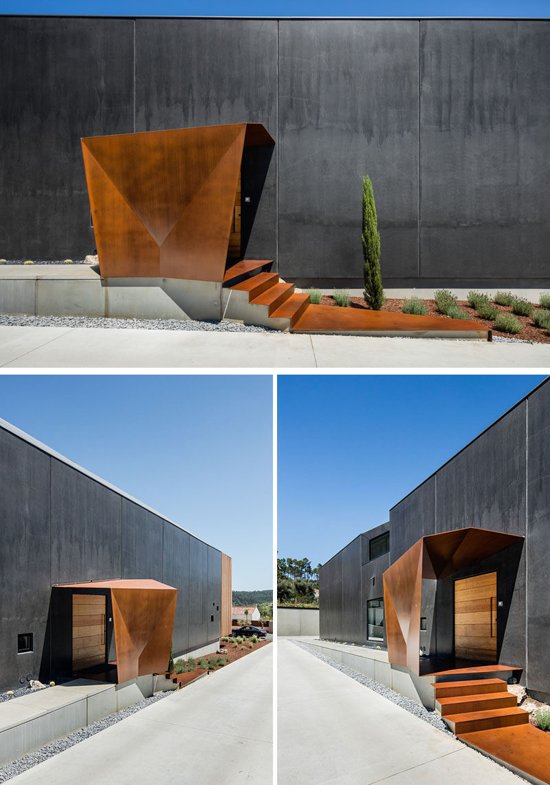 At the side of the house is a path that leads to the front door, that's somewhat hidden underneath a cover of weathered steel. #HouseEntry #FrontDoor #Architecture