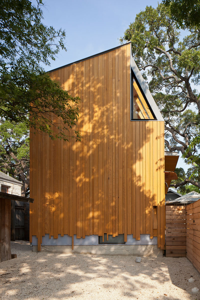 On the exterior of this modern addition, wood lengths have been cut to create a staggered appearance, adding an artistic touch to the architecture. #WoodExterior #Architecture