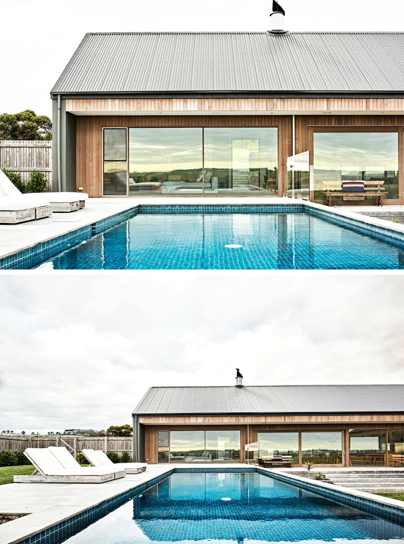 This modern ranch-inspired house, has a pool that sits at the same level as the interior living room. #SwimmingPool #ModernHouse