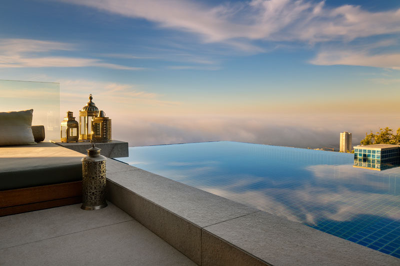 This modern apartment has an outdoor terrace with an infinity pool overlooking the ocean. #InfinityPool #SwimmingPool