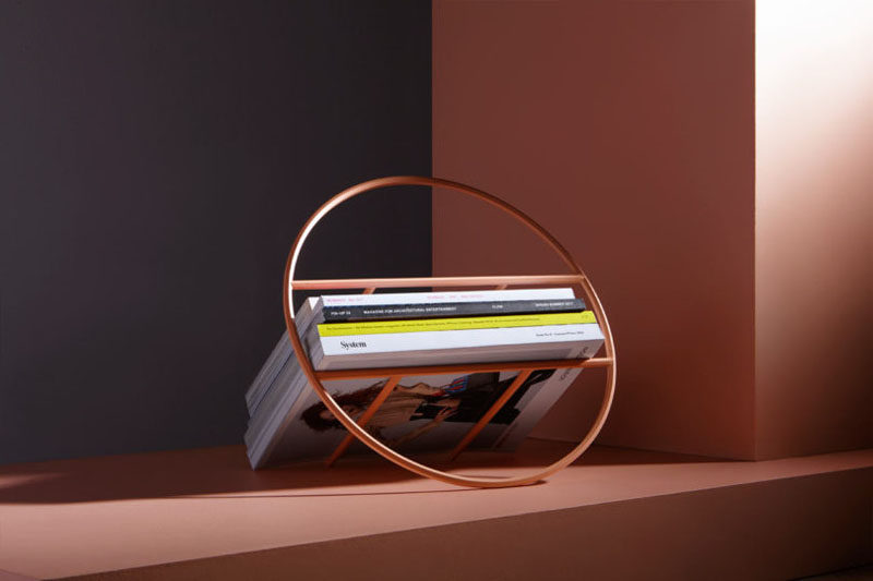 Umbra Studio have designed 'Hoop', a minimalist magazine rack that can also hold up to 24 records. #Storage #HomeDecor #MagazineRack