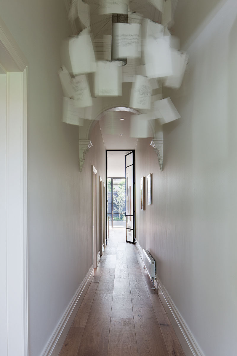 This renovated house has a long hallway that leads right down to the living areas of the home. #Hallway #InteriorDesign