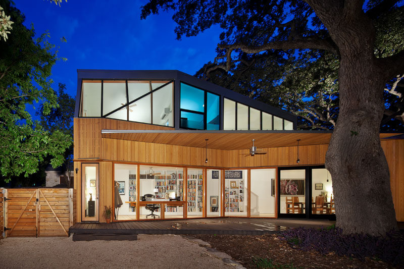 Murray Legge Architecture have designed a modern addition to a 1920s bungalow in Central Austin, Texas, that wraps around an existing 150-year-old oak tree. #Architecture #Addition #Extension #ModernHouse