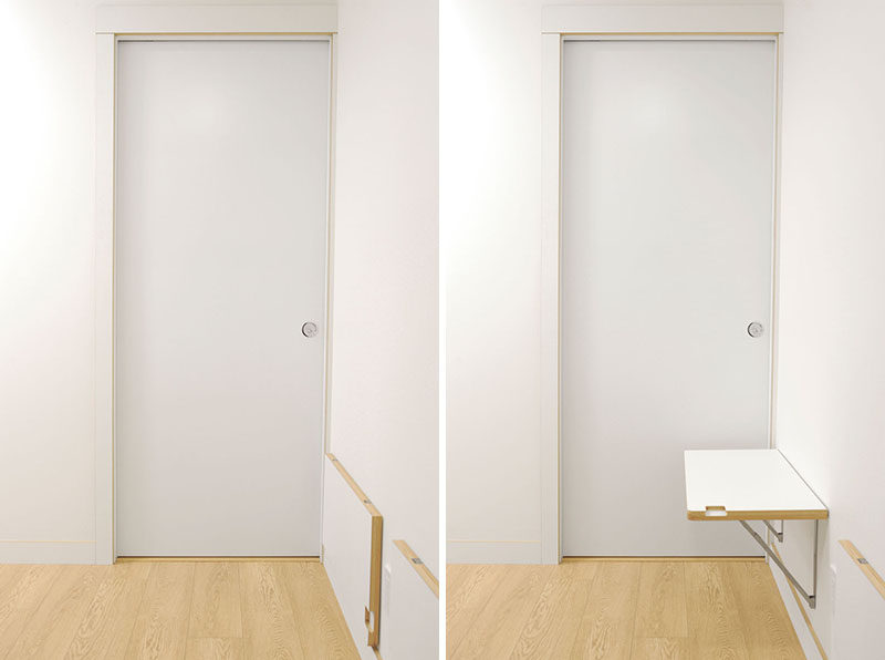 In this entry hallway, small fold-down tables were affixed to the wall, creating a small work area or space for keys, wallets etc. #Hallway #Tables #InteriorDesign