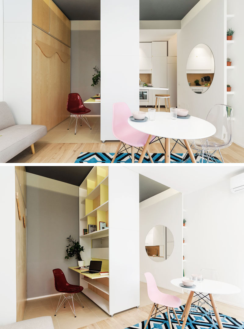 Next to the living room in this micro apartment is a movable wall. When it is positioned in the center, it can have a down desk on one side, and a fold down table on the other. On the desk side, there's open shelving for extra storage. #MicroApartment #MovableWall #InteriorDesign #SmallApartment