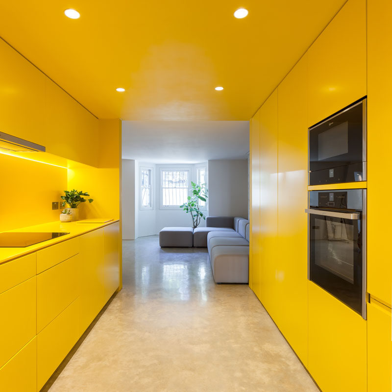 London-based architectural and design practice Russian for Fish, were tasked with brightening up the basement of a Victorian terrace home, and they did this using the color yellow. #ModernKitchen #YellowKitchen #KitchenDesign