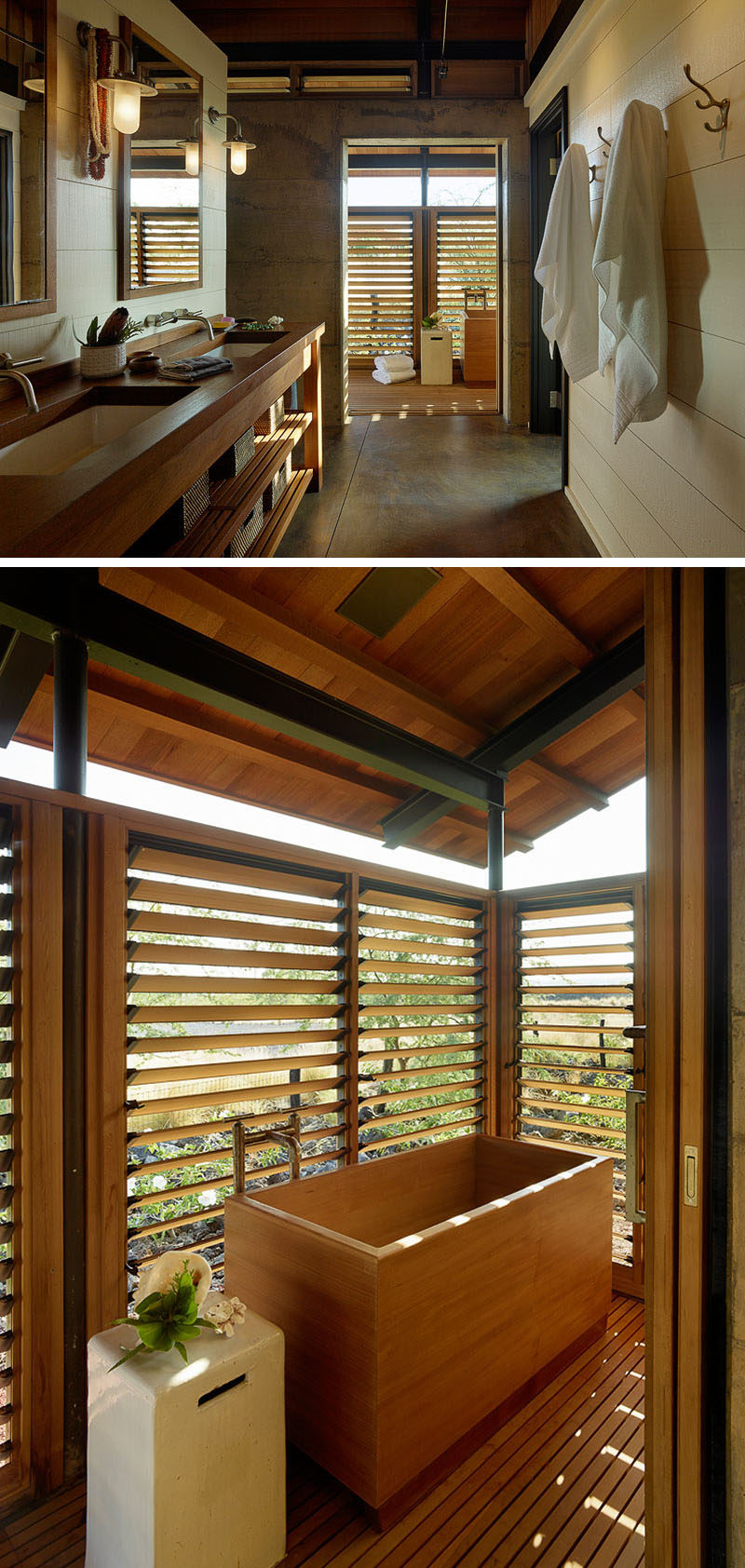In this contemporary bathroom there's a wood vanity with exposed shelving, and through a doorway, there's a deep wood soaking tub with views of the surrounding landscape. #BathroomDesign #SoakingTub