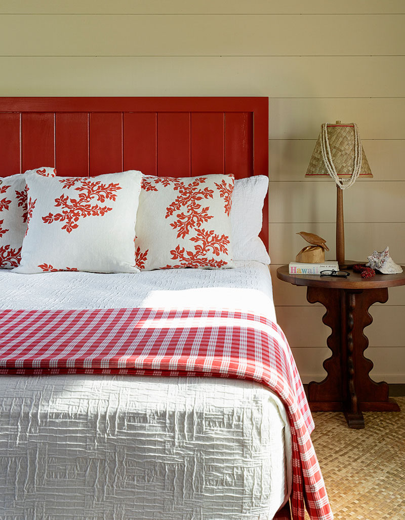 In this contemporary bedroom, red has been used to brighten up the other more neutral tones. #ContemporaryBedroom #BedroomDesign