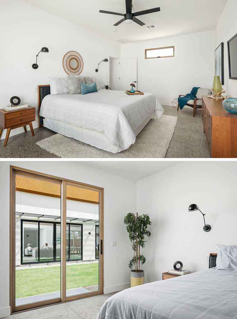 In this modern master bedroom, wood window frames, furniture and door frames add warmth to the room, while exposed aggregated concrete floors add texture. #ModernBedroom #ConcreteFloors #WoodWindowFrame