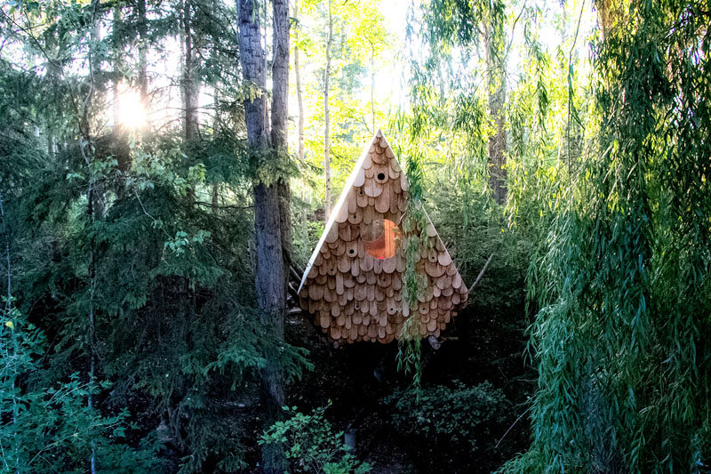 Studio North have designed the Birdhut, a treetop perch that sits within the tree canopy and can accommodate two people, and has a facade with twelve birdhouses. #Cabin #Hut #BirdHouse