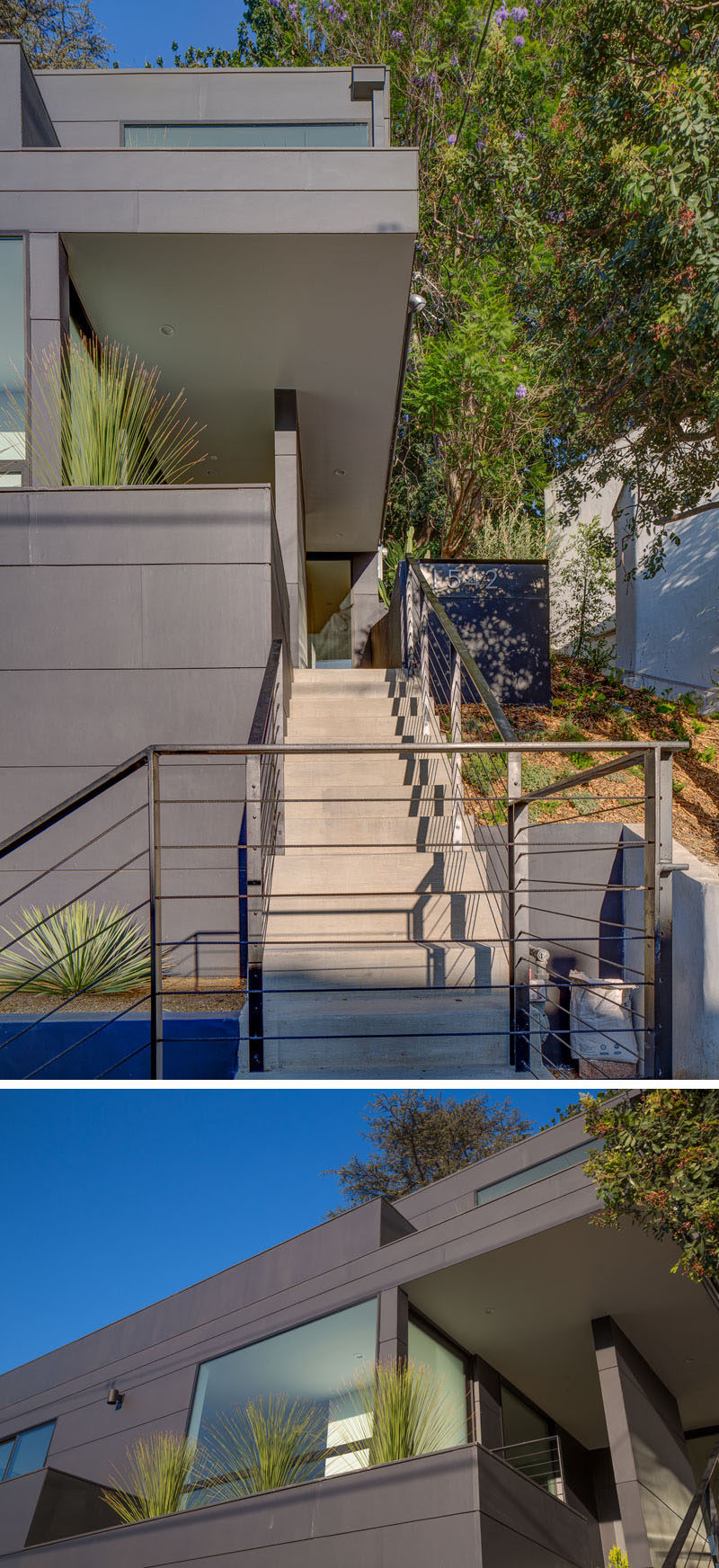 This modern house has concrete stairs with a minimalist black handrail lead up to a small covered deck that provides protection from the elements and access to the front door. #ExteriorStairs #Architecture