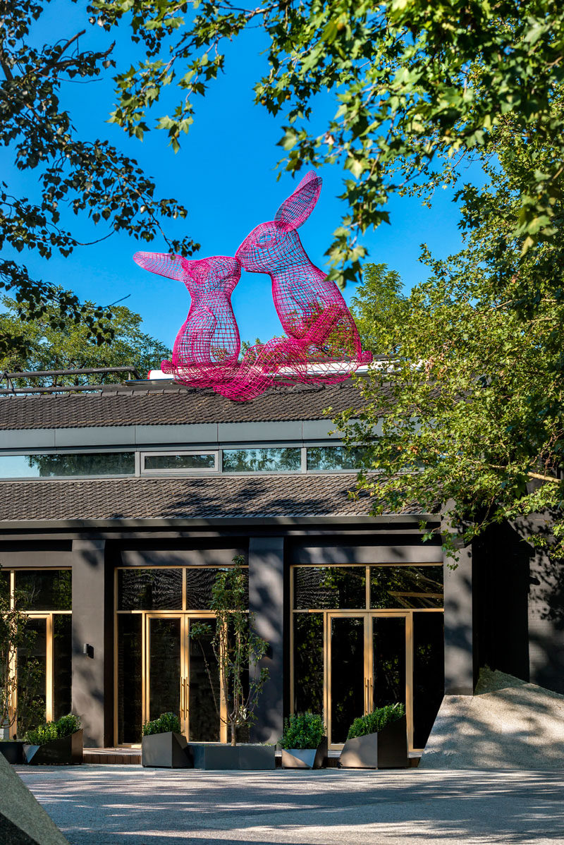 Artwork is scattered throughout this modern hotel in Beijing, like these two whimsical wire-frame rabbits that sit on the roof of The Pink Rabbit Restaurant. #Sculptures #HotelDesign #Beijing