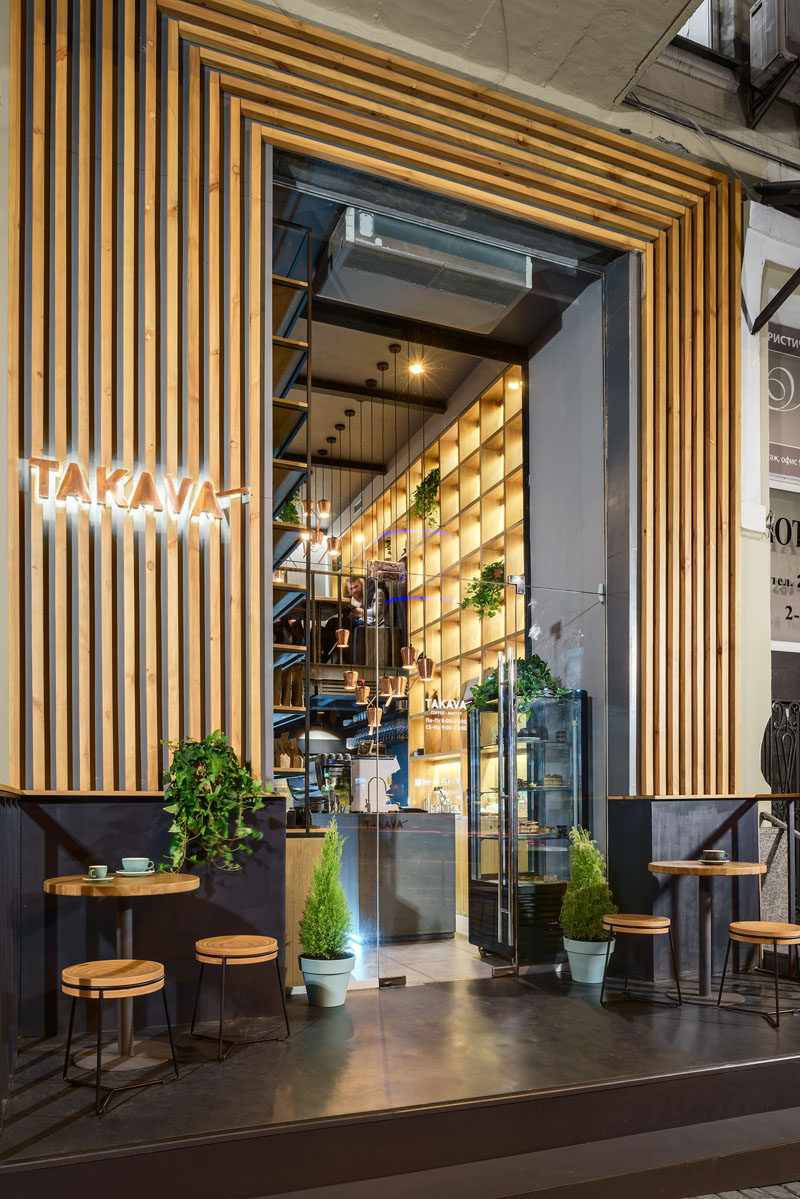 YUDIN Design have recently completed a TAKAVA, new coffee shop in Kiev, Ukraine, that features a warm wood facade with a view of the inside through large windows and an over-sized glass door. #ModernCoffeeShop #ModernCafe #WoodFacade