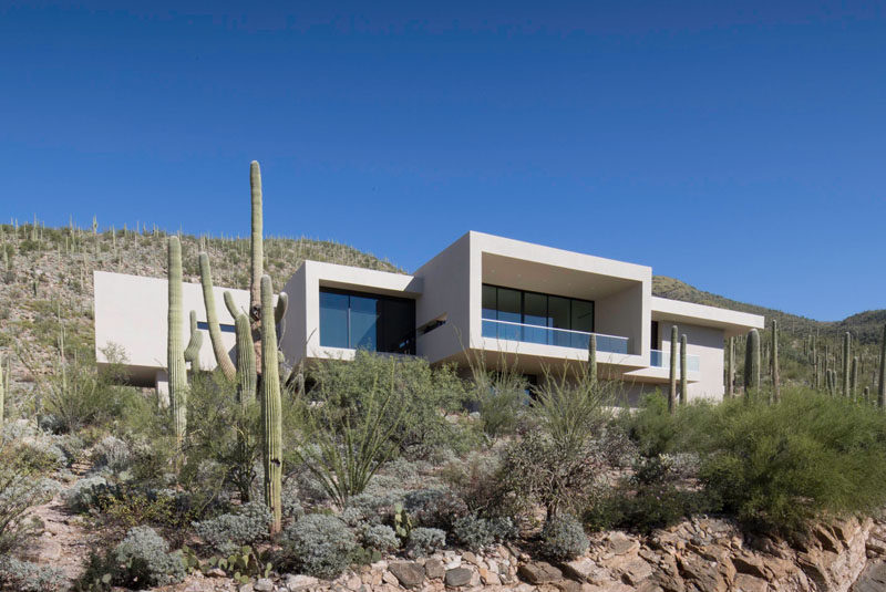 Kevin B. Howard Architects have designed a modern house in the foothills of Tucson, Arizona, for their client who requested a "modern, minimal home: a pristine box that seemed to have landed in the desert.” #ModernHouse #Architecture