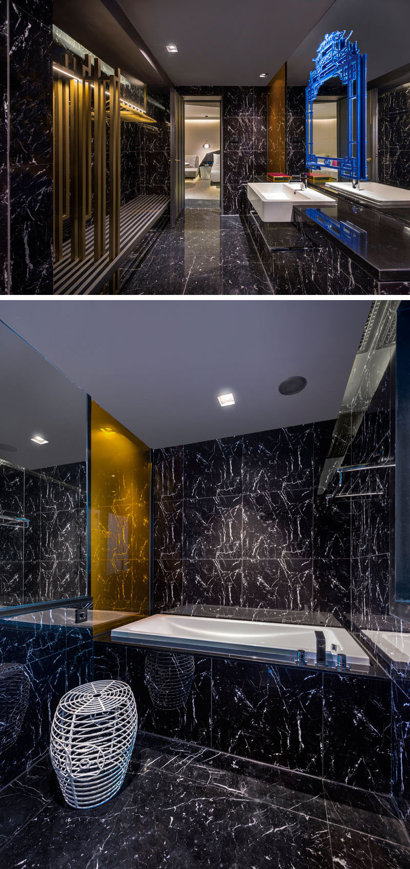 In this modern hotel bathroom, gold accents have been used and a blue artistic decorative accent breaks up the large mirror. #ModernBathroom #HotelBathroom #BlackBathroom