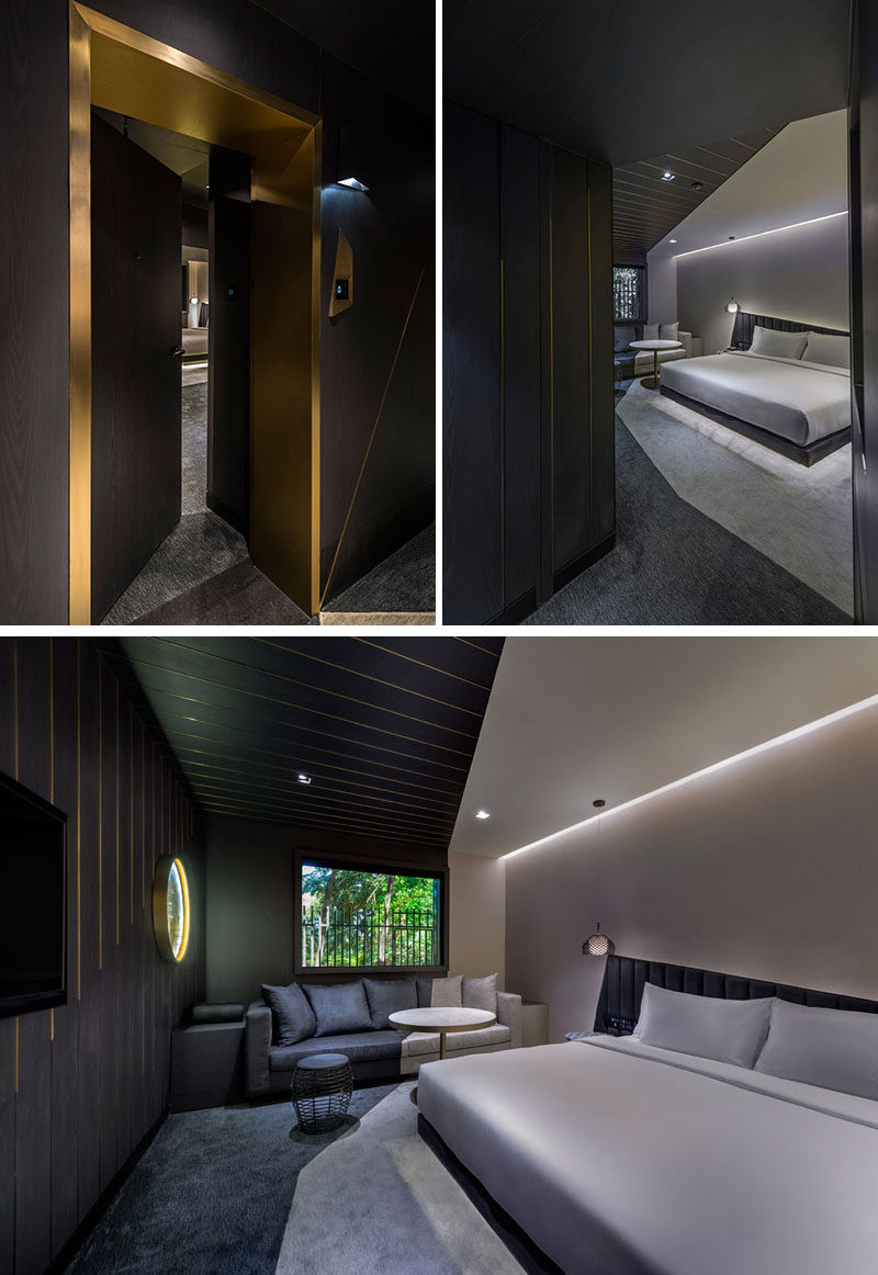 Metallic entryways scattered along dark hallways guide you to the rooms of this modern hotel in Beijing, China. Inside, the angles featured throughout the hotel also show up in the rooms. #HotelRoom #Doorway #HiddenLighting