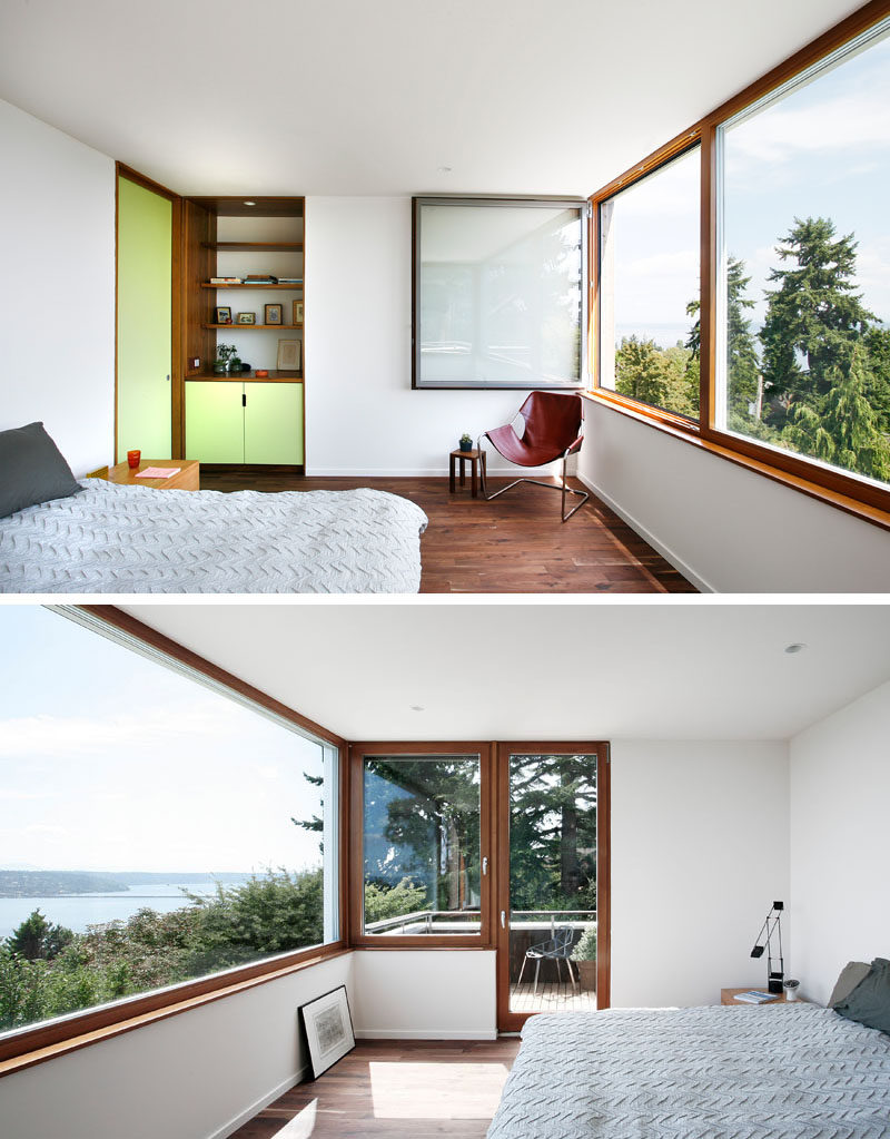 Pastel green has been used to add a touch of color to this modern master bedroom, while picture windows and a small balcony provide views of the surrounding landscape. #MasterBedroom #PictureWindows #Balcony