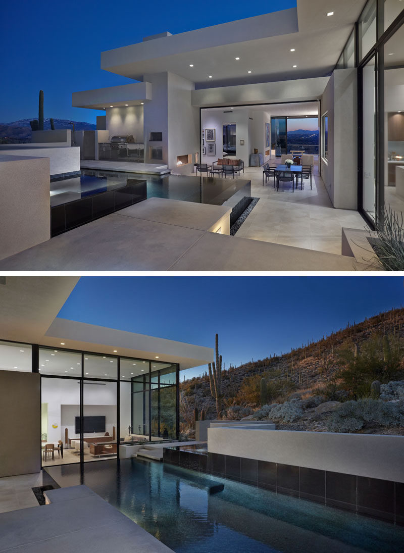 Located off the interior living spaces of this modern house is deck with a swimming pool and spa, an outdoor dining and living area with fireplace, and a bbq / outdoor kitchen. #OutdoorEntertaining #SwimmingPool #ModernHouse