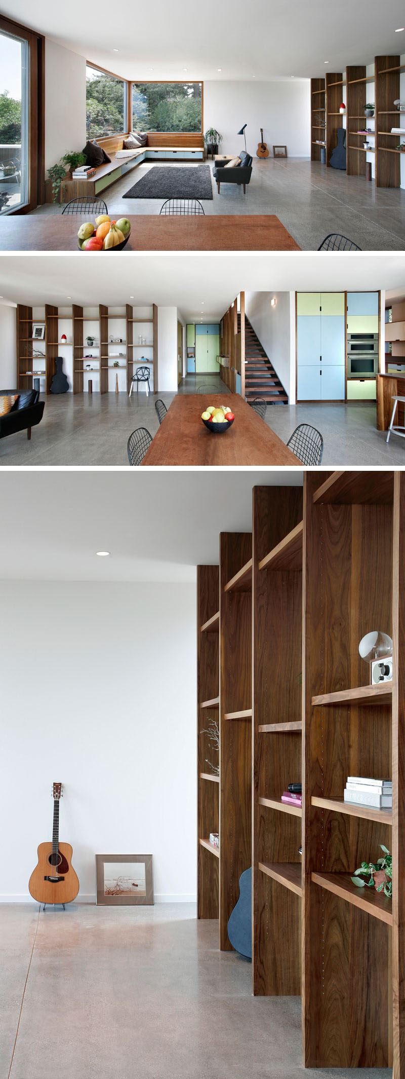 In this modern house, the living room, dining area and kitchen all share the same space, with the living room at one end and the kitchen at the other. Built-in wood benches sit underneath large windows, while a wood shelving unit lines the wall. #InteriorDesign #LivingRoom #Shelving