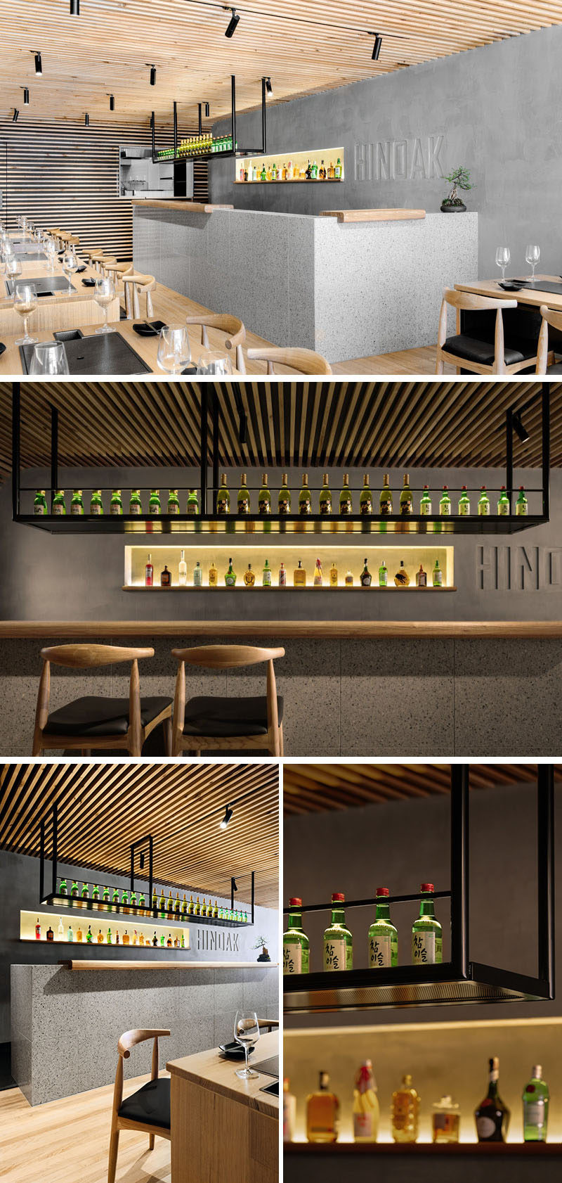 The bar at the rear of this modern Korean BBQ restaurant is encased in terrazzo tiles and topped with sculpted timber benchtops that sit atop the bar in sections. Above the bar, suspended black display shelving descends from the ceiling, and behind the bar, there's a backlit niche cut into the wall that displays fine spirits. #BarDesign #InteriorDesign #RestaurantDesign