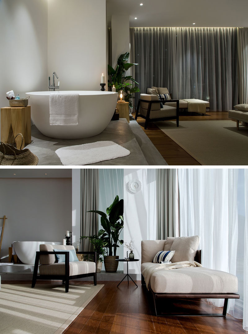 This open plan apartment has a small sitting area bedside the bathtub. #SittingArea #InteriorDesign