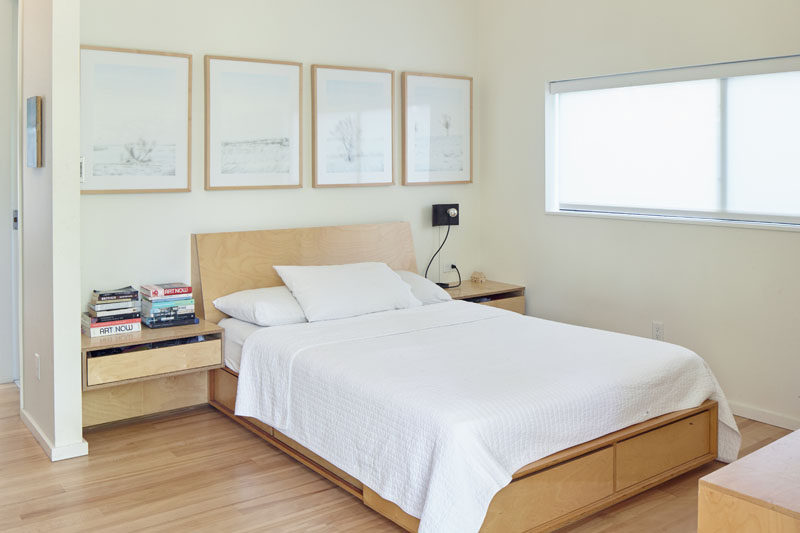 This modern master bedroom has been kept light and airy, with the use of white, light colored walls and light wood. #ModernMasterBedroom #MasterBedroom #BedroomDesign