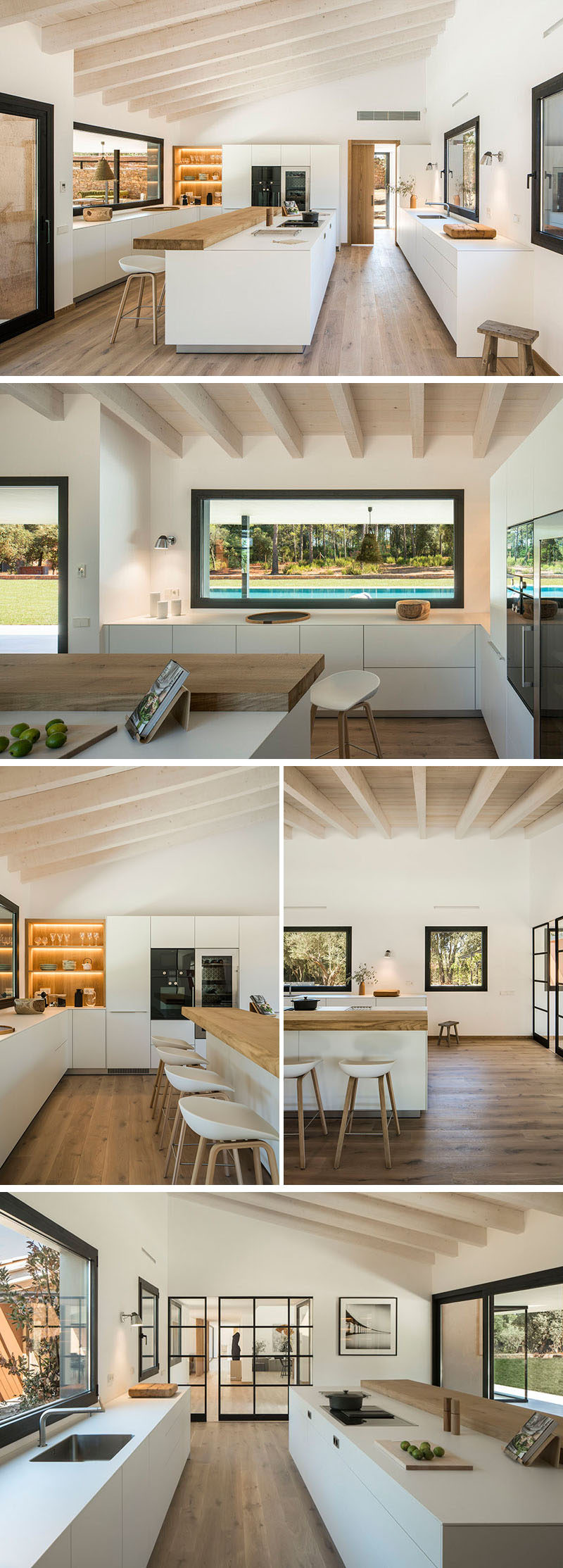 In the kitchen, a sloped ceiling creates a feeling of space, while the kitchen has been split up into three different work areas with a long wood bar top and island positioned in the middle. Throughout the kitchen, white minimalist cabinets are the main storage elements, while exposed wood shelving with back-lighting highlights a few favorite items. #KitchenDesign #ModernKitchen #KitchenLayout