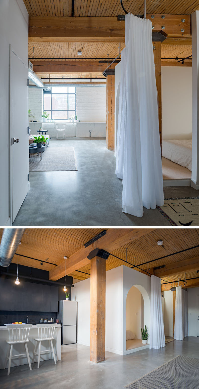 Studio AC have designed a modern loft in Toronto, Canada, for a young professional that wanted something fun, functional and unique. To achieve this, the designers used a combination of curtains and walls to create privacy and separation in the space. #ModernLoft #InteriorDesign