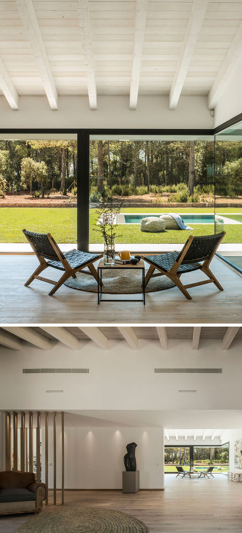 In a light-filled corner of this house, a small sitting area sits in front of large windows that provide a view of the landscaped lawn. #SittingArea #Windows #InteriorDesign