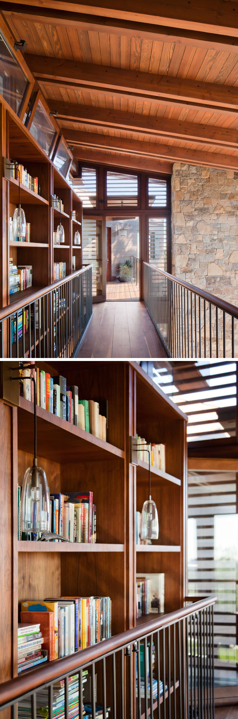 At the top of the stairs in this house is a walkway that connects to the sleeping areas of the home. A large wood bookshelf lines one side of the walkway, while the other looks over the living room and dining area below. #Bookshelf #InteriorWalkway #Shelving