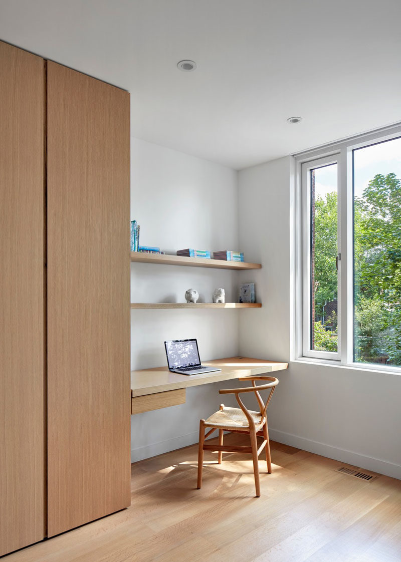 In this modern child's bedroom, a small homework desk is sandwiched between the floor-to-ceiling closet and the wall. Two wood shelves keep favorite items within reach. #Desk #Shelving