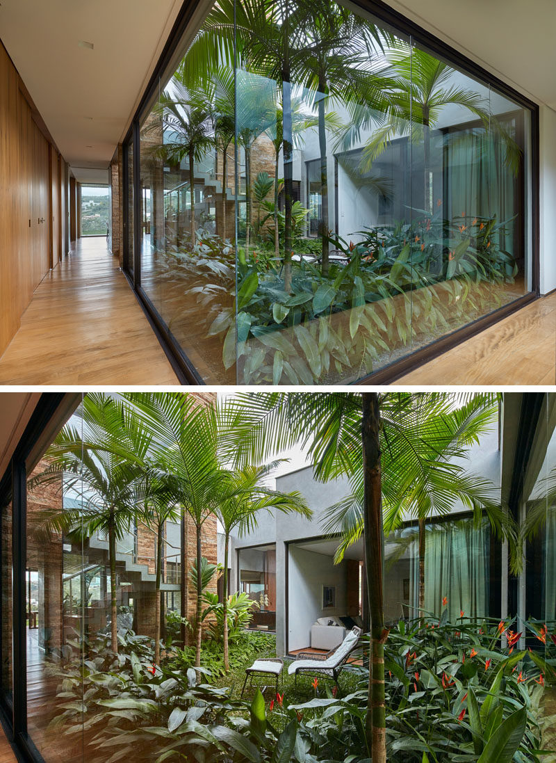 This modern house has an internal garden positioned in the middle of the home, creating a centerpiece that the house wraps around. Floor-to-ceiling windows provide a view of the garden, while at the same time allowing light to flow through to the interior of the home. #InternalGarden #Architecture #Windows