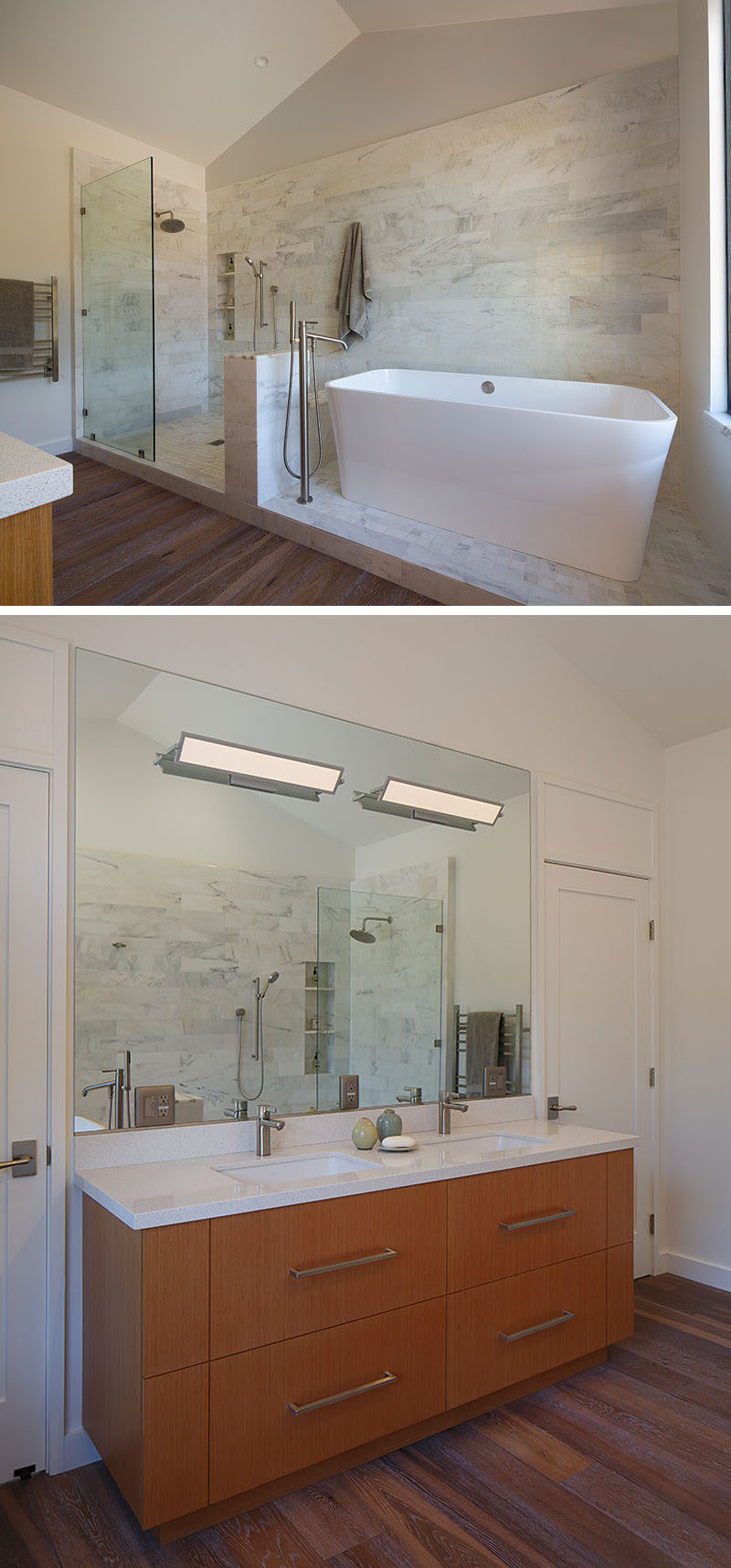 In this modern bathroom, a high ceiling makes the room feel spacious, while a tiled area is home to the walk-in shower and the freestanding white bathtub. On the opposite wall, a wood vanity is topped with a white counter and a large mirror helps to reflect light. #ModernBathroom #BathroomDesign