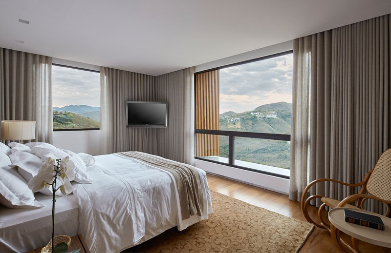 This modern bedroom has a neutral color palette to allow the mountain views to be the focus of the room. #ModernBedroom #BedroomDesign