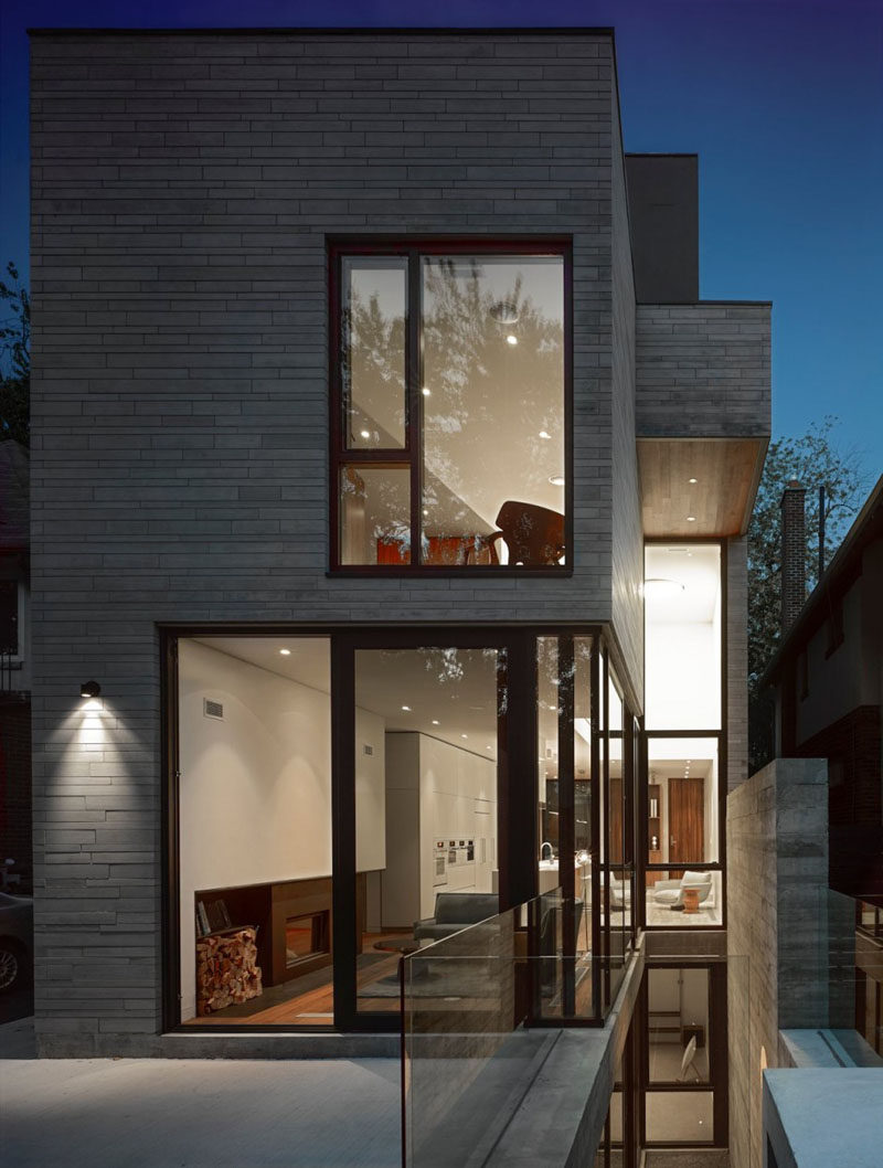 This modern house has a grey exterior with black window frames. #ModernHouse #Architecture #Windows