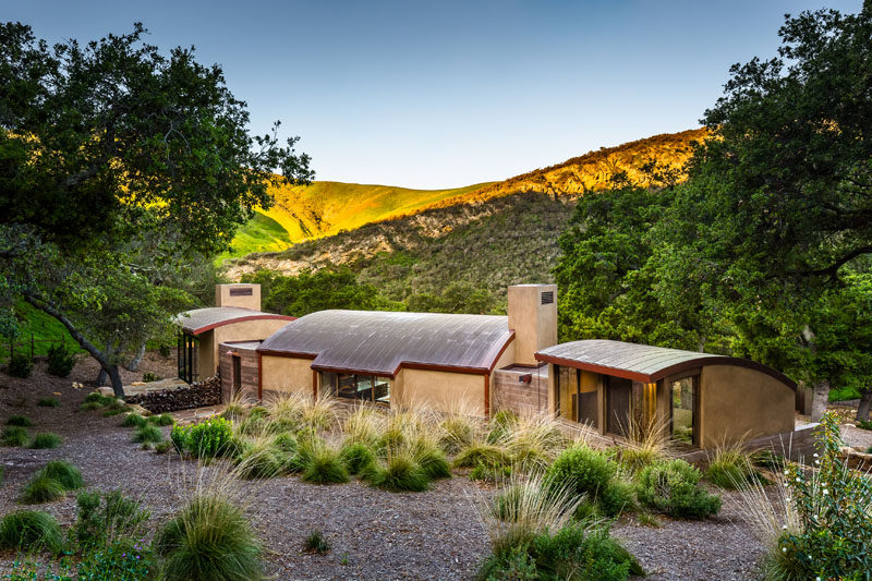 This house features a curved roof made from flat seam weathered copper. #CopperRoof #HouseDesign